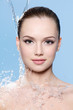Portrait of beautiful teen girl under the stream of water