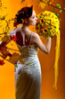 Photo: Gorgeous young redhead woman with bouquet of flowers Gorgeous young redhead woman with bouquet of flowers