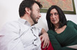 Portrait of Adult Couple Relaxing on Sofa at Home