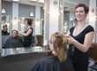Woman getting a haircut at a beauty salon