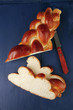 Photo: golden challah cuts over blue golden challah cuts over blue