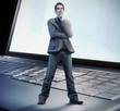 Thinking man standing on the keyboard
