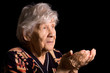 Portrait of the old woman a black background