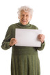 Portrait of a happy senior woman holding blank billboard against
