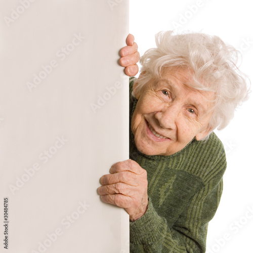Photo: The old woman spies isolated on white background The old woman spies isolated on white background