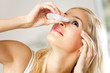Young woman dripping eyes at home