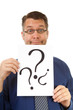 male nerdy geek is holding text board with question marks