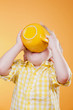 funny child drink from big yellow cup