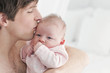 Father kissing baby