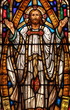 Stained Glass window of Jesus holding his hands up