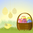 Basket of Easter eggs in the meadow