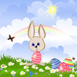 Rabbit with Easter eggs on lawn