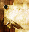Compass and magnifier on textured paper