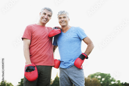 Photo: Boxer standing with his sparring partner Boxer standing with his sparring partner