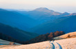 Sunrise autumn mountain road view.