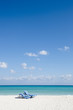 Beach chairs on perfect tropical white sand beach