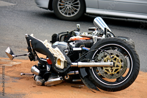 Photo: black motorbike accident on the asphalt road black motorbike accident on the asphalt road
