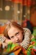 Photo: Sad child. Girl lying on bed, looking at camera. Sad child. Girl lying on bed, looking at camera.