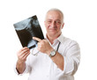 Foto: Friendly mature doctor chiropractor, human neck x-ray Friendly mature doctor chiropractor, human neck x-ray