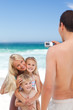 Man taking a photo of his family Man taking a photo of his family
