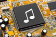 Music note on computer chip Music note on computer chip