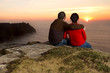 Photo: Loving Couple at sunset on irish Cliffs of Moher Loving Couple at sunset on irish Cliffs of Moher