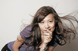 Chinese Asian model posing with wind blowing hair