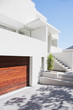 Driveway and staircase of modern white house