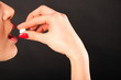 a woman taking pill