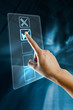 A woman hand selects an option  on a screen