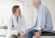Doctor checking patient?s reflexes in doctor?s office