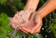 Woman's hands with water splash