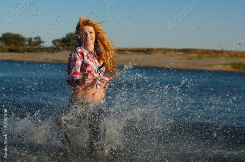Photo: The red girl on a beach The red girl on a beach
