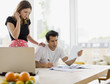 Concerned couple paying bills together