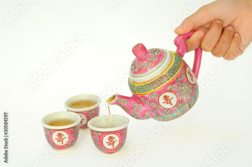 Photo: Pouring Hot Tea Into A Tea Cup Pouring Hot Tea Into A Tea Cup