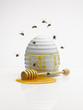 Bees flying around honey jar