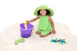 Beautiful Young Girl Sitting In the Sand Playing