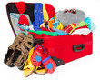 Family travel red suitcase packed for vacation Family travel red suitcase packed for vacation