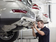 Mechanic working on car in auto repair shop