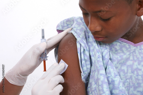 Photo: Boy In Hospital Gown About To Get An Injection Boy In Hospital Gown About To Get An Injection