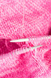 Handmade needle knitted pink canvas background