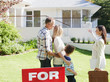 Realtor showing family a house for sale