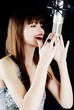 woman singing to the microphone in a studio woman singing to the microphone in a studio