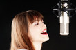 young artist woman recording in a studio young artist woman recording in a studio
