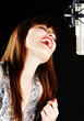 young artist woman recording in a studio young artist woman recording in a studio