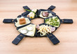 Raclette pans with food, ideal for party