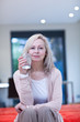 Smiling mature woman holding glass of water