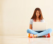 Beautiful young girl using laptop