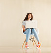 Smiling girl using laptop