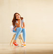Girl sitting on chair and smiling